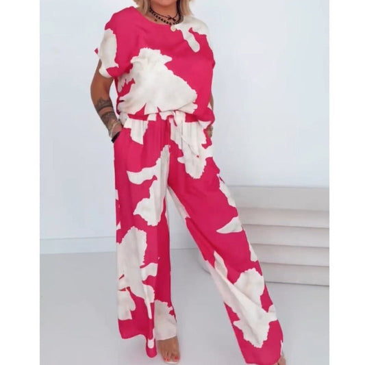 Somrig, kortärmad topp med rosa och vitt tryck och byxor med vida ben, 2-delat set